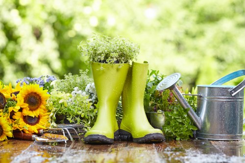 Gardener trimming shrubs in a Chislehurst residential garden
